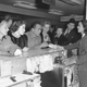 A group of actors flying to Washington from Los Angeles October 26, 1947 to protest the House Un-American Activities Committee hearings. Left to right are: June Havoc, Marsha Hunt, Humphrey Bogart, Lauren Bacall, Evelyn Keyes, Paul Henreid. At the rear is Danny Kaye.